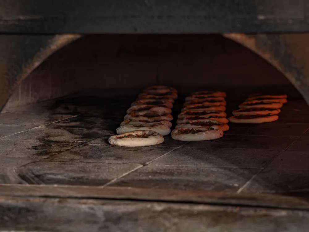 Flatbread baking in a stone oven
